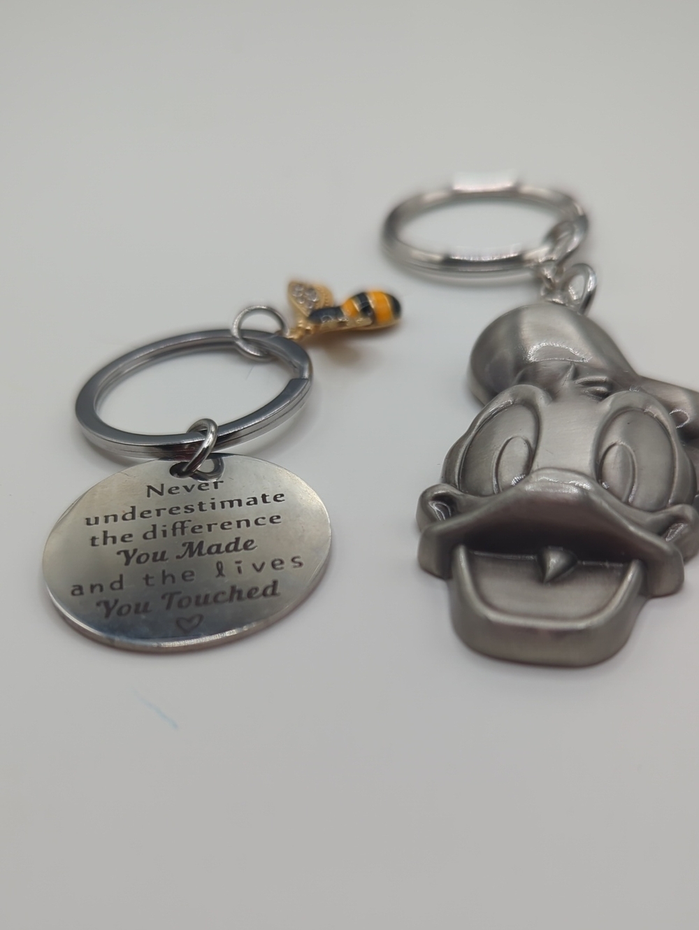 Silver Donald Duck Keychain with Inspirational Disc and Bee Accent